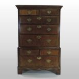 An 18th century walnut and inlaid chest on chest,