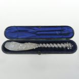 A Victorian silver butter knife, the blade with etched decoration and rope twist handle,