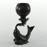 A Chinese bronze censer, in the form of a carp supporting a bowl,