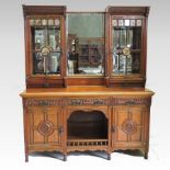 A Victorian aesthetic period walnut mirror back sideboard,