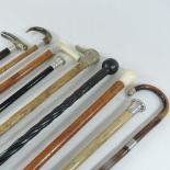 A collection of 19th century and later walking sticks, to include horn,