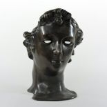 An Italian style bronze sculpture in the form of a mask, after the antique,