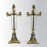 A pair of 19th century continental gilt painted three branch candelabra,
