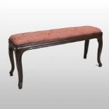 A 19th century rosewood duet stool, standing on cabriole legs,