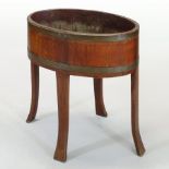 A 19th century coopered light oak and brass bound wine cooler, on a splayed base,