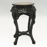 A Chinese carved rosewood jardiniere stand, with a rouge marble top,