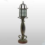 An Arts and Crafts style brass table lamp, in the form of a lantern,