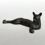 A bronze model of an Egyptian cat, in a reclining pose,