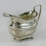 An early 20th century silver cream jug, of helmet shape, Sheffield 1928,