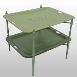 A green and gilt painted metal two tier tray top occasional table, on a folding stand,