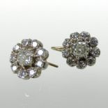 A pair of diamond cluster earrings, each central stone approximately .