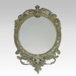 A 19th century gilt gesso wall mirror, of oval shape, with scrolled decoration,