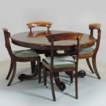 A Victorian rosewood breakfast table, the oval top, on a turned column and splayed quadruped base,