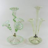 A Victorian glass epergne, having four clear and green glass trumpet shaped vases,