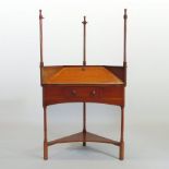 An Art Nouveau Liberty style fruitwood corner desk, having turned supports,