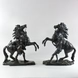 A pair of bronze figure groups of Marley horses, after Cousteau,
