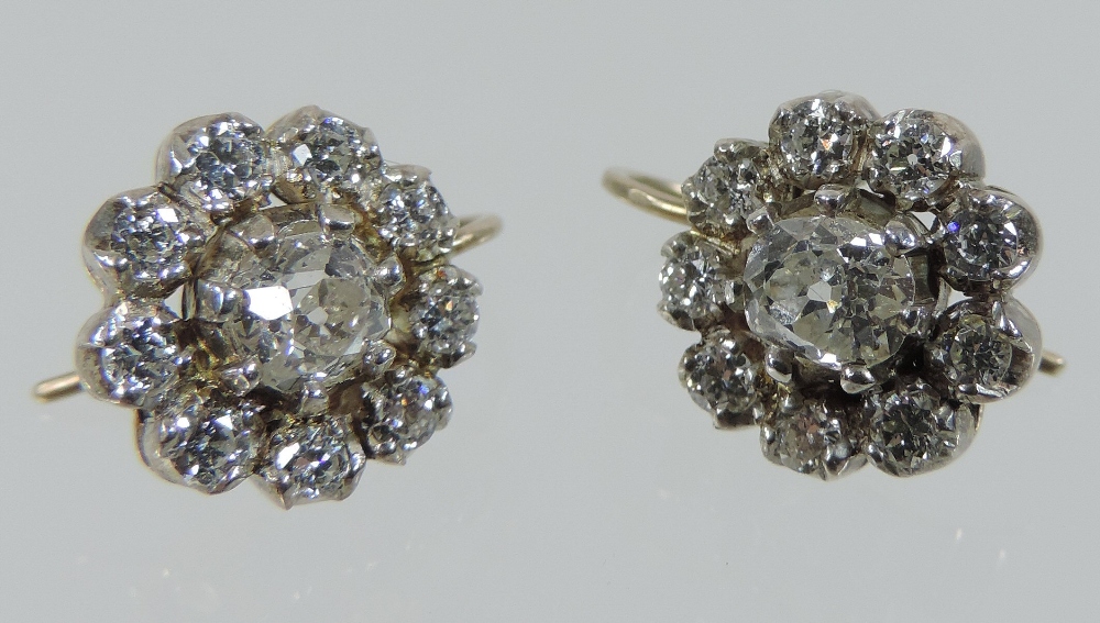 A pair of diamond cluster earrings, each central stone approximately . - Image 4 of 5