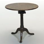 A 19th century yew wood occasional table, having a circular tilt top,