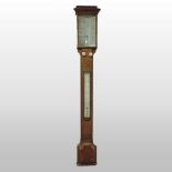 An early 20th century oak cased stick barometer and thermometer,