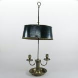 A 19th century toleware and brass desk lamp, with an adjustable shade,