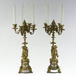 A pair of 19th century ormolu and polished stone four branch table candelabra,