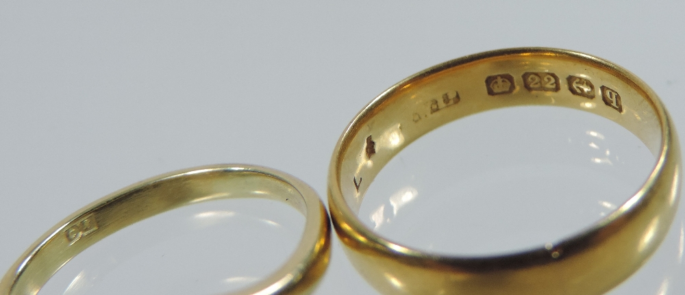 A 22 carat gold wedding band, - Image 2 of 4