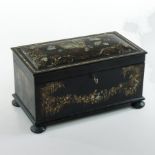 A 19th century black papier mache and inlaid tea caddy, of slightly domed rectangular shape,