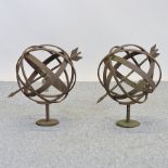 A pair of garden iron armillaries,