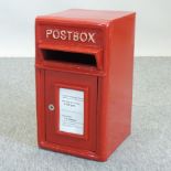 A red painted GPO style metal wall mounted postbox,