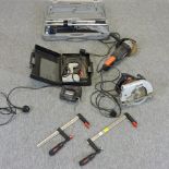 A collection of power and other tools, to include an angle grinder, tile cutter, disc saw,