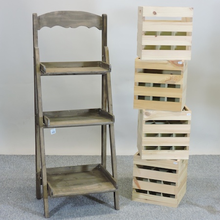 A set of wooden folding graduated shelves,