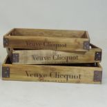 A set of three graduated Veuve Clicquot champagne wooden trays,