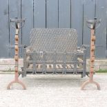 A cast iron fire grate, together with a pair of irons,