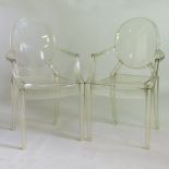 A pair of clear perspex Louis Ghost armchairs,