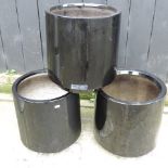 A set of three black garden pots,
