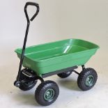 A green plastic garden cargo truck,