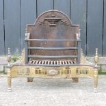 A Regency style cast iron and brass fire grate,
