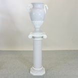 A pottery jardiniere, with swan handles, on a matching pedestal,