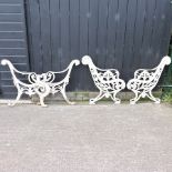 A pair of ornate 19th century painted cast iron bench ends,