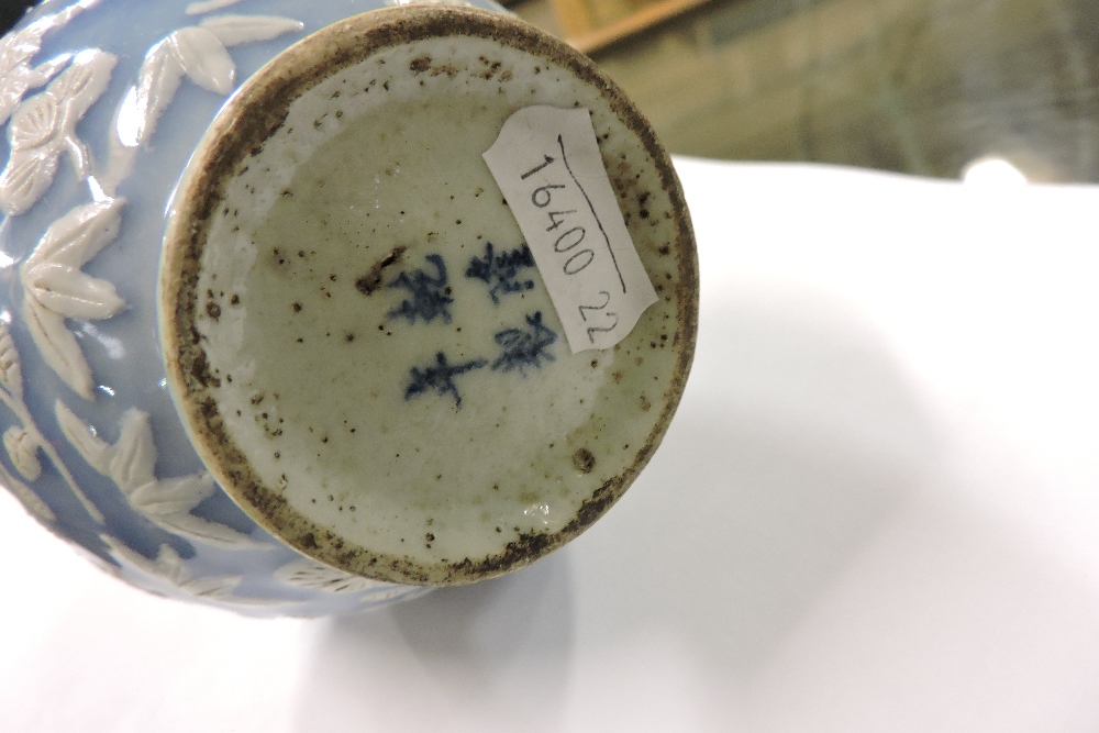 A Chinese blue and white porcelain vase, relief decorated with flowers, character marks to base, - Image 5 of 5