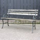 A slatted wooden garden bench, with metal ends,