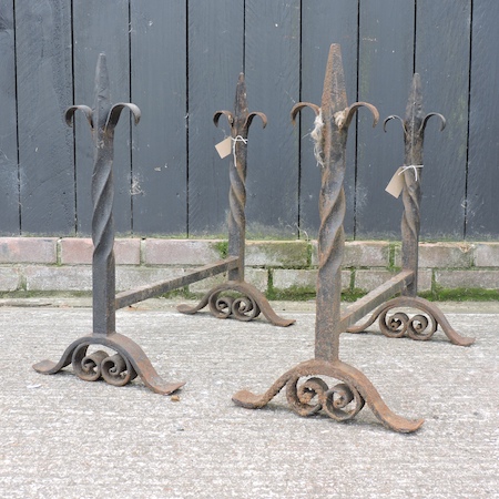 A pair of wrought iron fire dogs,