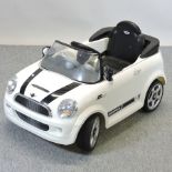 An electric children's Mini Cooper ride on toy car,
