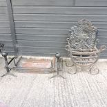 A cast iron fire basket and dogs, together with another basket, and a fire back,