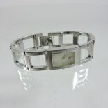 A Calvin Klein ladies steel cased wristwatch, with a gem set bezel,