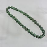 A string of turquoise beads,