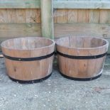 A pair half barrel planters,