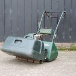 An Atco petrol driven lawn mower,