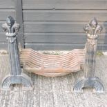 A cast iron fire basket, together with a pair of fire dogs,