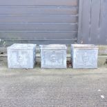 A pair of lead planters, together with another,